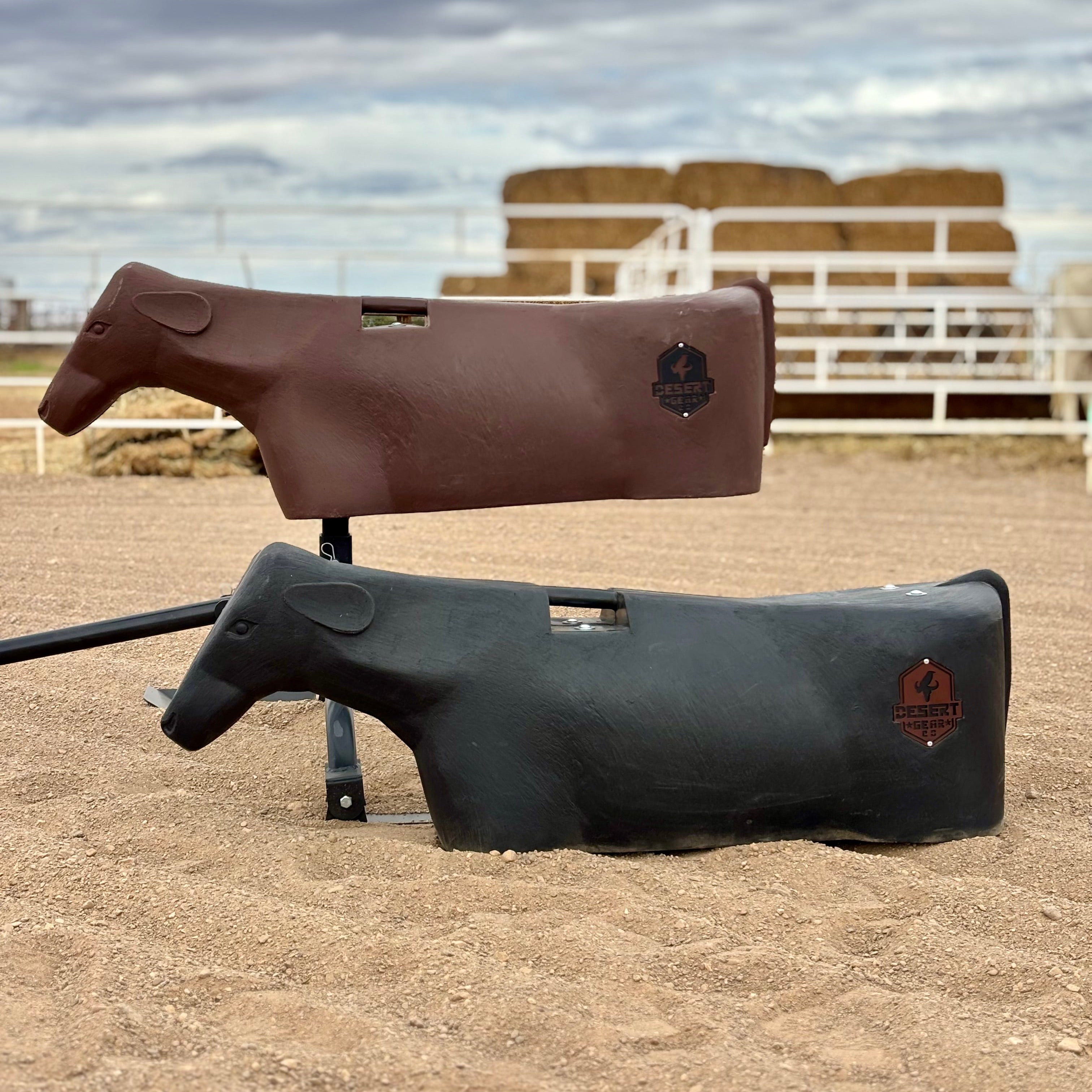 brown and black breakaway roping dummy on sled